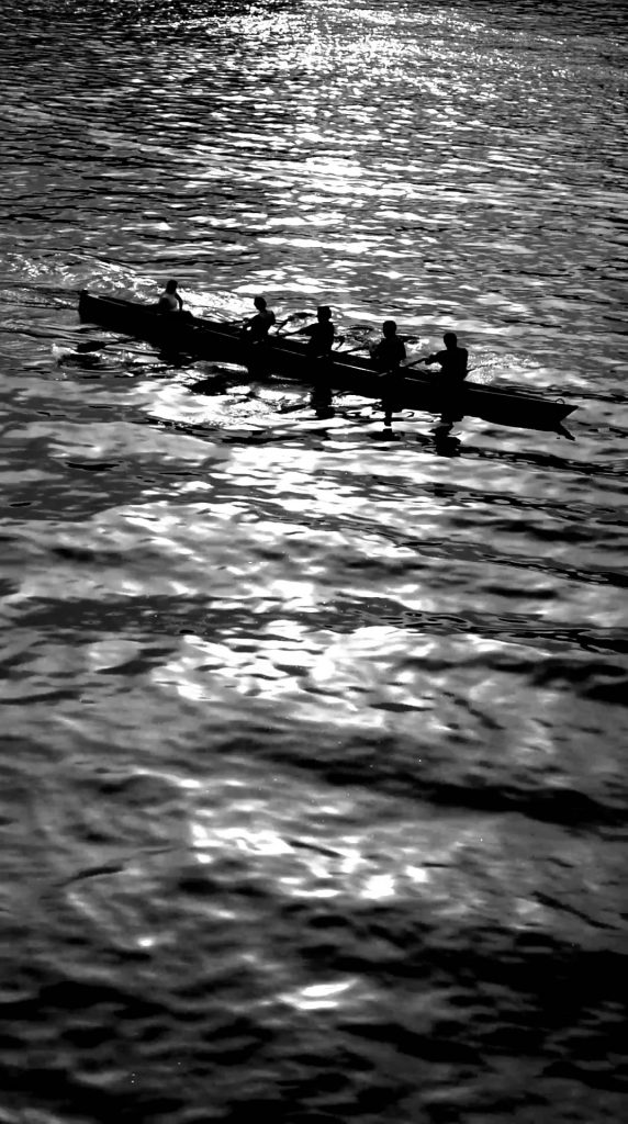 Black and white canoe silhouette on the river